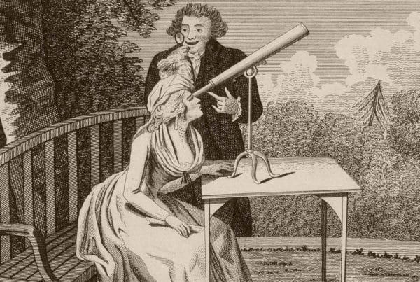two people using telescope to search
