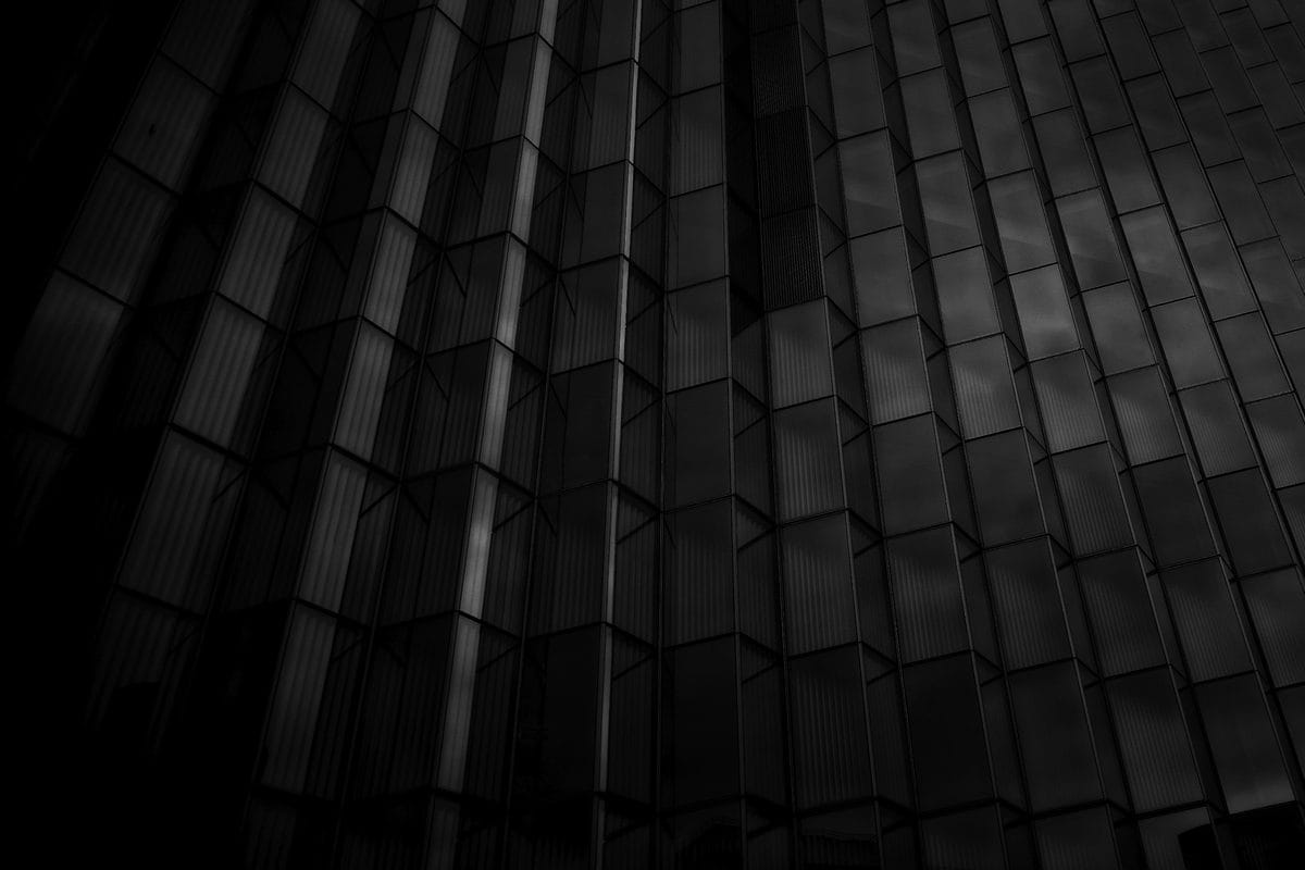 Dark modern architectural facade, abstract enterprise hero image
