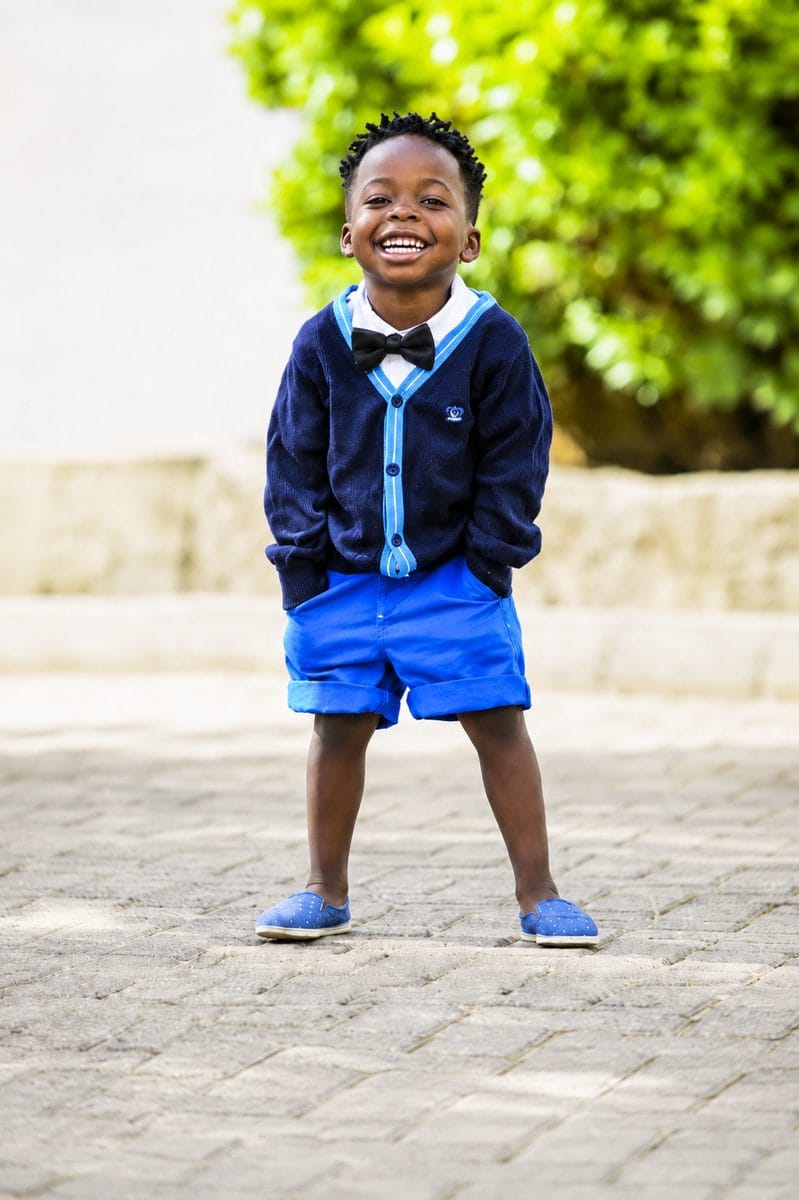 Smiling young child standing outdoors, representing the American Academy of Pediatrics digital transformation